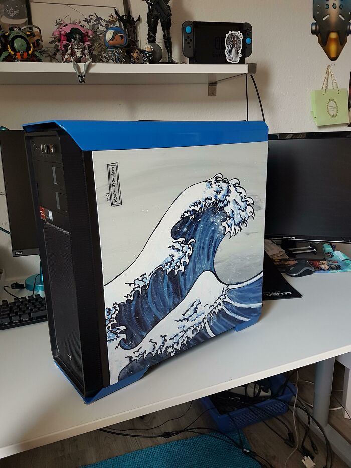 Custom painted Japanese wave art on a PC case displaying creativity to save money