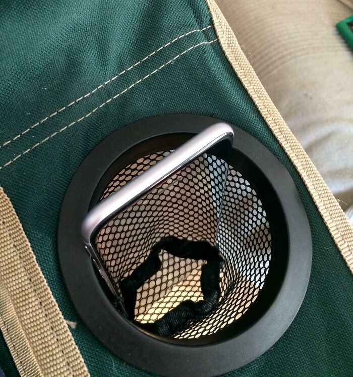 Phone seemingly stuck inside a mesh cup holder glitch