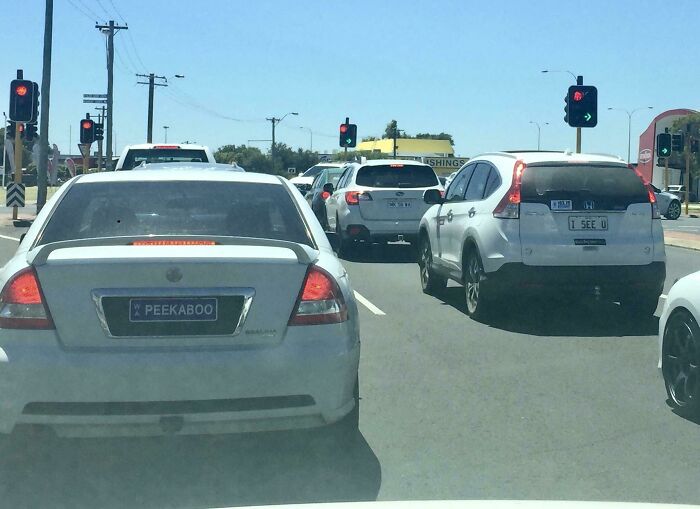 Car with humorous license plate Peekaboo stuck in traffic glitch