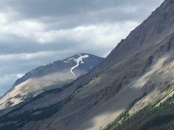 Mountain with snow resembling a human figure glitch
