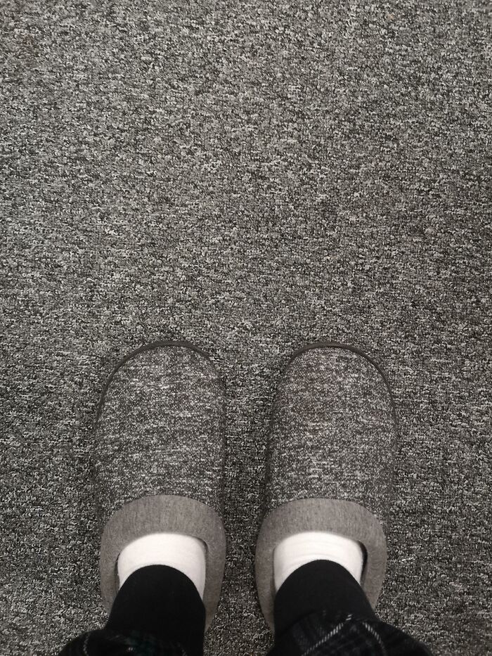 Person wearing slippers blending into matching carpet matrix glitch