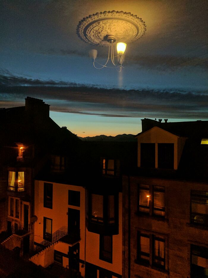 Light fixture oddly reflected in night sky causing visual glitch