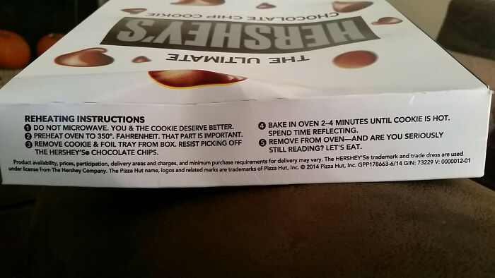 Hilariously confusing instructions printed on a Hershey box about reheating chocolate chip cookies.