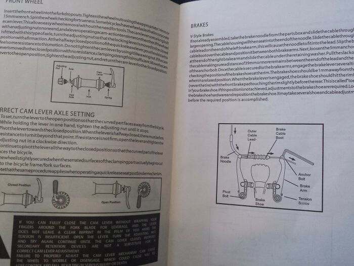 A dense wall of text with bicycle diagrams demonstrating confusing instructions for front wheel and brake settings.