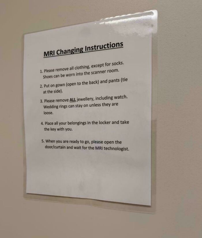 Confusing instructions posted on a wall for MRI changing room rules.