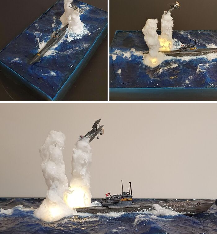 Miniature models of naval warship with explosion and aircraft in ocean scene