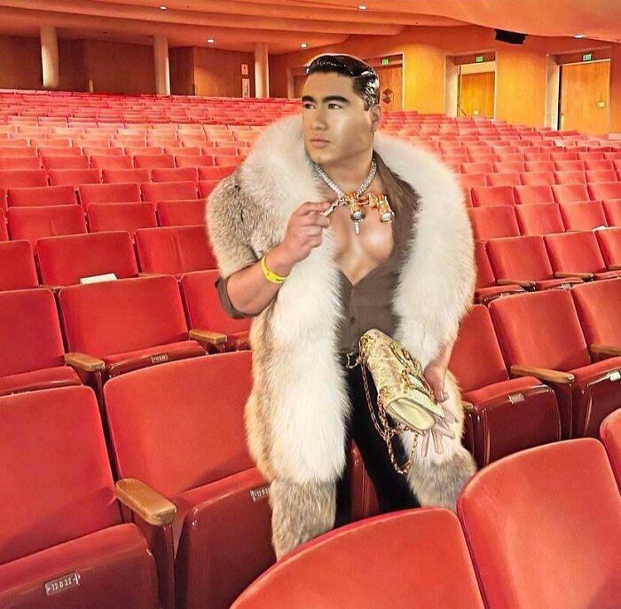 Ridiculous edited photo of man in fur coat in empty theater