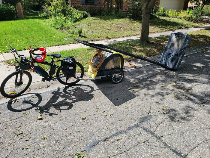 Bicycle pulling a trailer that is dragging an entire basketball hoop as an example of towing gone wrong.