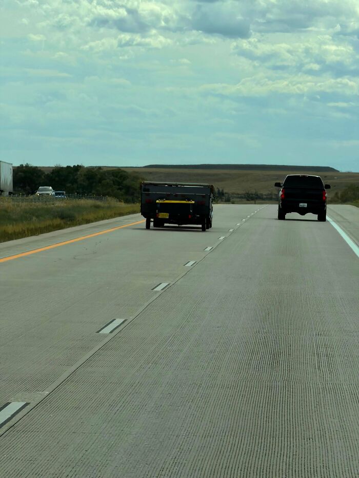Pop-up camper trailer detached and driving alone on a highway, illustrating extreme towing gone wrong.