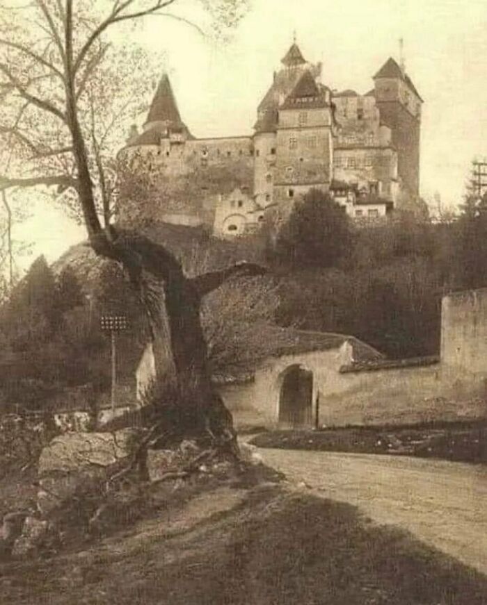 An old vintage photograph of a medieval castle on a hill, highlighting surprising facts about the past.