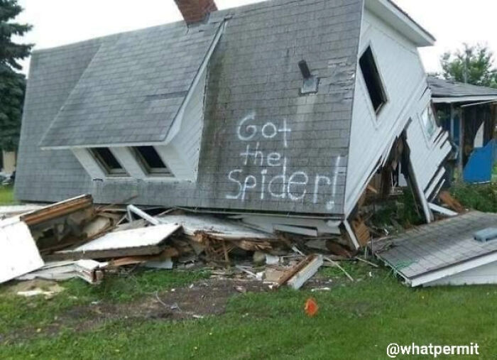 A completely collapsed house with Got the Spider written on the roof, a classic construction fail meme.