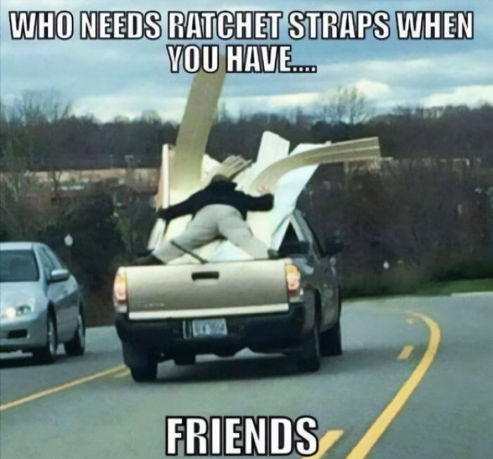 A person holding down cargo in a pickup truck bed, illustrating funny cringe construction fails memes.