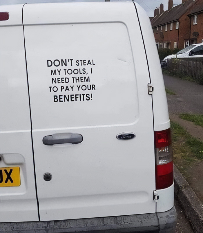 White work van with a funny quote about tools, showcasing funny cringe construction fails memes.