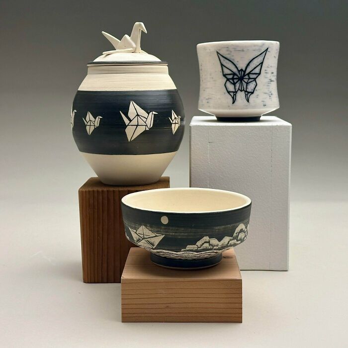 Set of ceramic pottery creations with origami crane, butterfly, and boat designs.