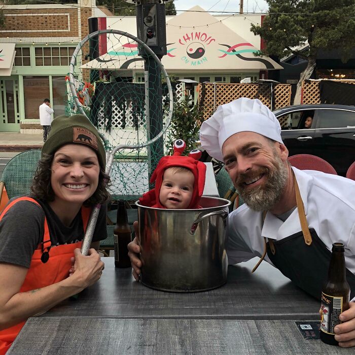 Family enjoying Halloween in chef and lobster in a pot creative Kids Halloween Costumes outdoors.