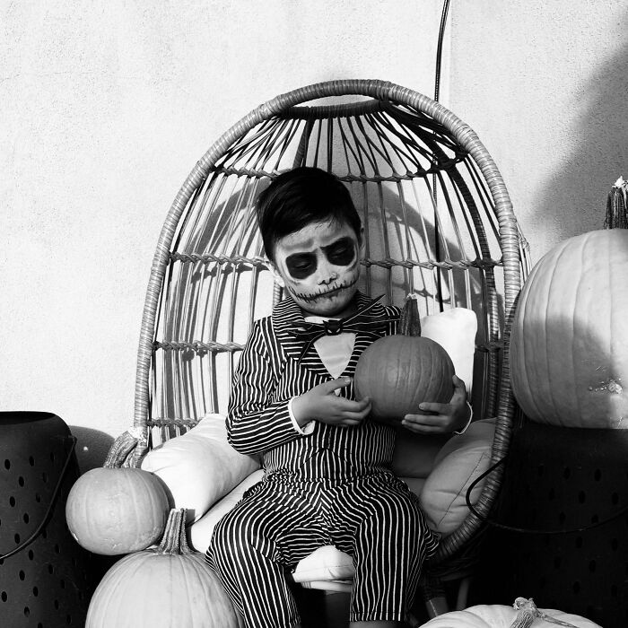 Black and white photo of a child dressed as Jack Skellington in a creative Kids Halloween Costume.