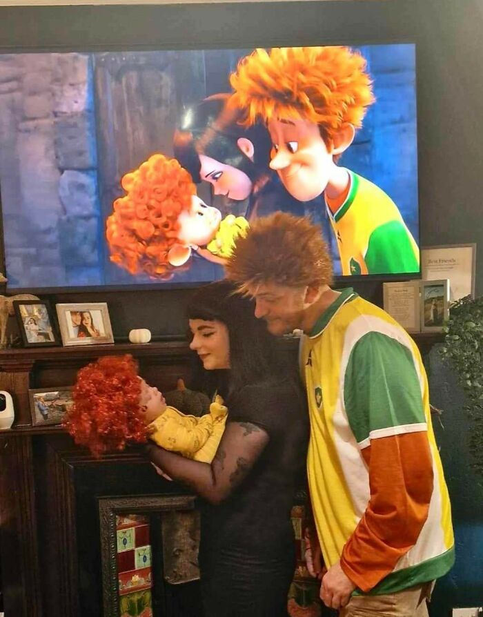 A family recreating an animated movie scene using themed Halloween costumes.