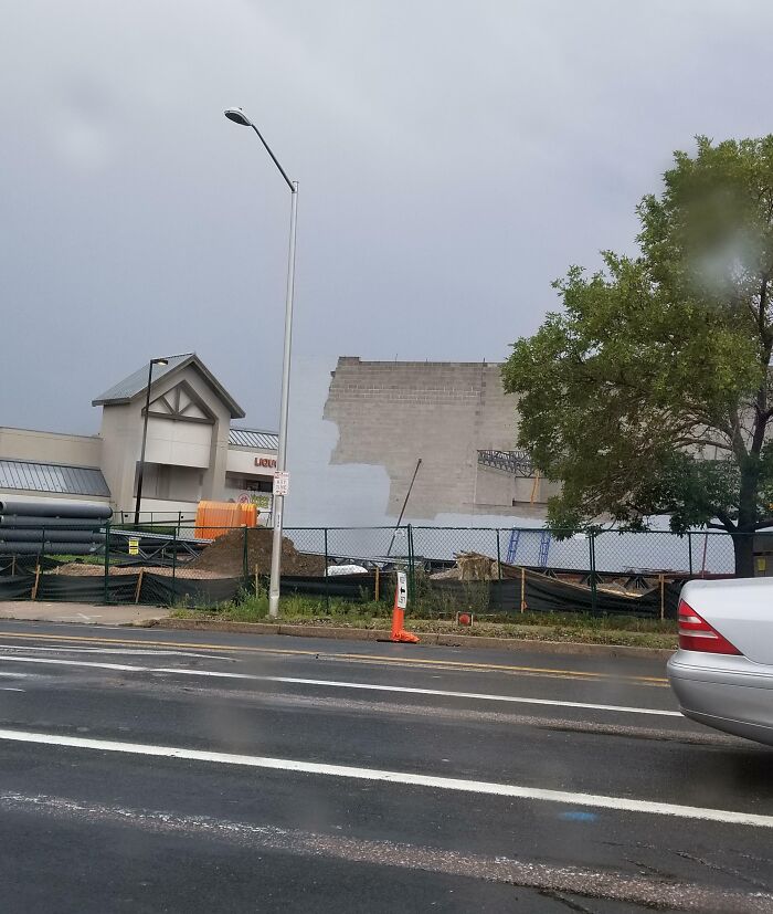Grey wall missing part of its construction in a construction site