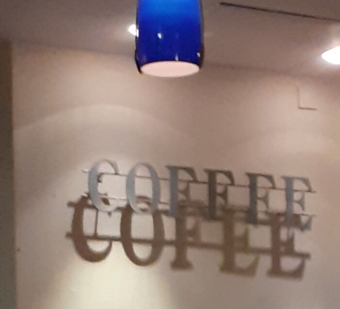 Wall decor casting overlapping shadow glitch spelling coffee twice