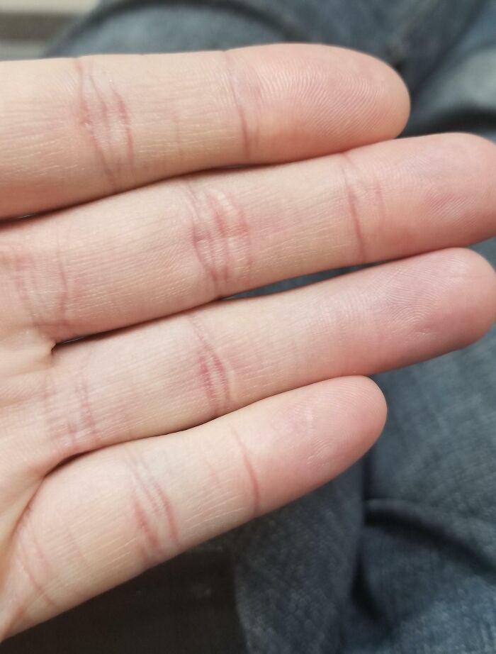 Close-up of fingers with unusual crease glitches