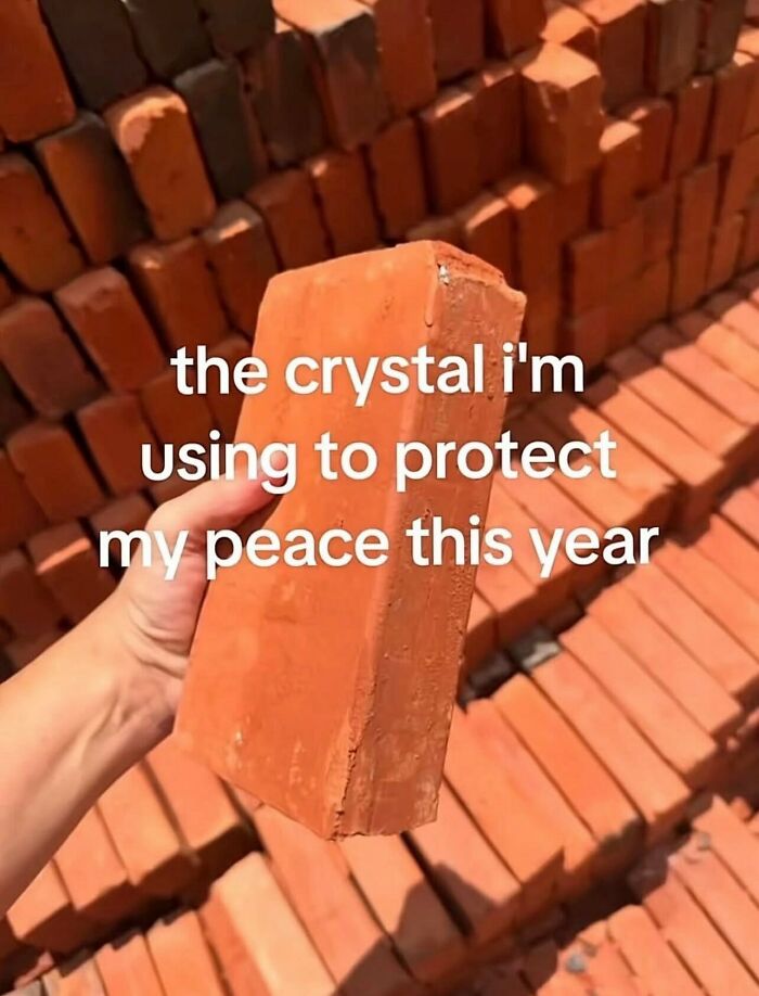 Relatable memes image showing a person holding a brick like a crystal to protect their peace.