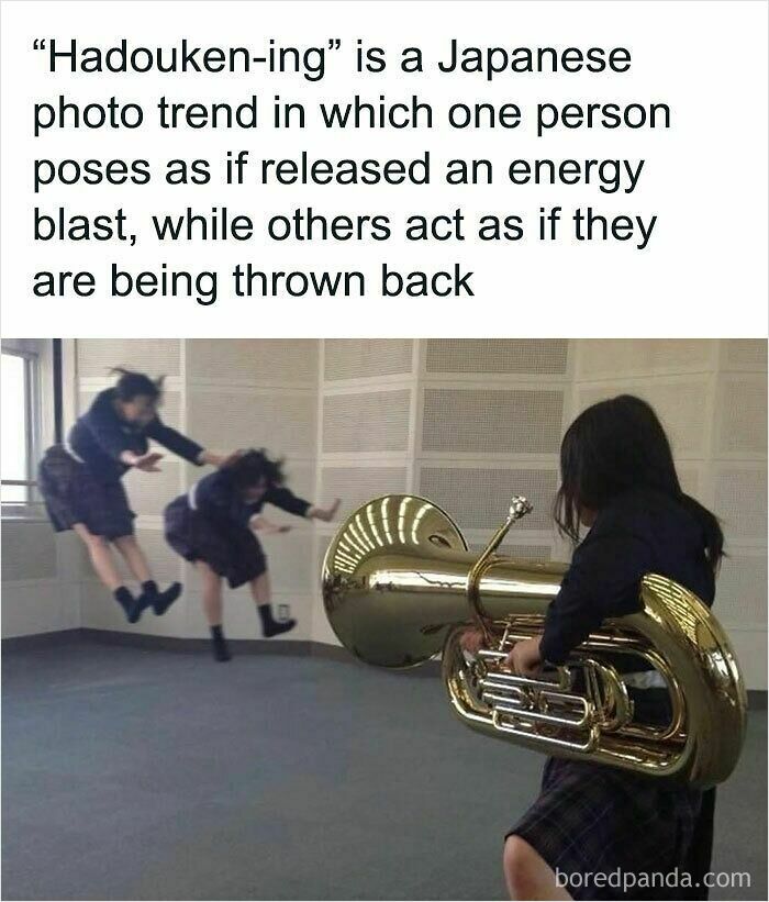 Wholesome memes picture of Japanese students doing a Hadouken-ing photo pose using a tuba.