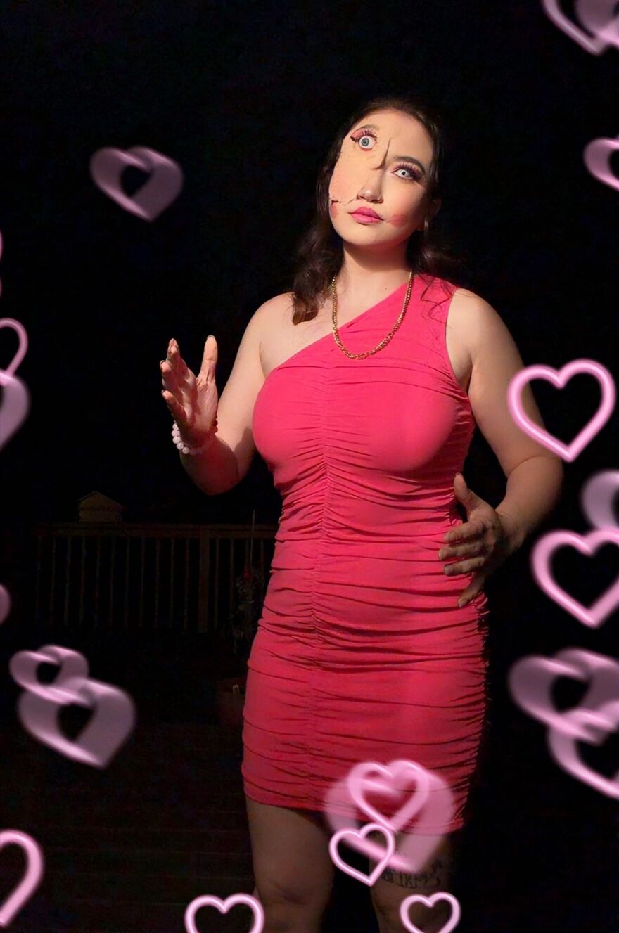 Woman with illusion makeup for creative Halloween costume ideas in a pink dress