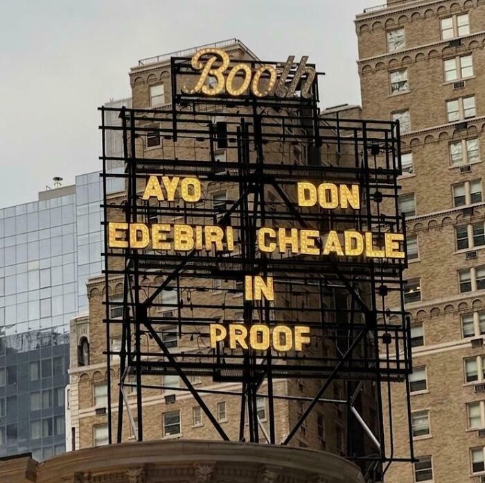 A theater marquee with confusingly arranged actor names, featuring terribly designed signs.