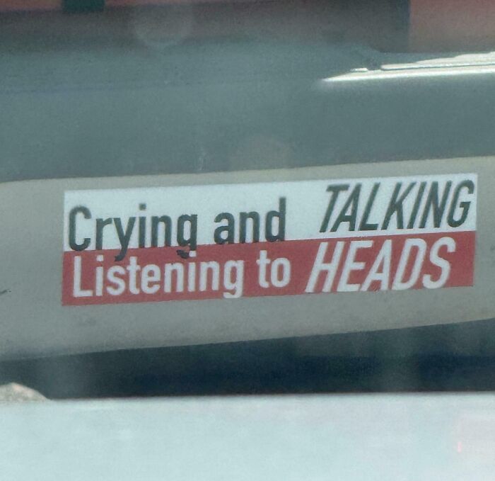 A car sticker reading Crying and TALKING Listening to HEADS, showing terribly designed signs.