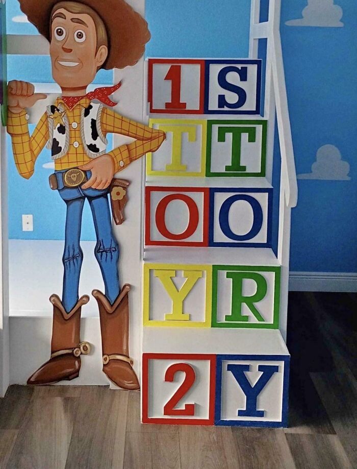 A poorly designed Toy Story cutout next to stairs as an example of terribly designed signs.