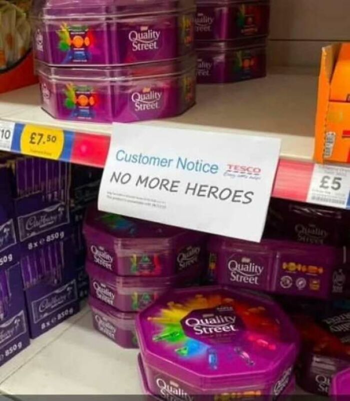 A supermarket shelf with a hilarious sign reading NO MORE HEROES, clearly missing the mark in product placement.