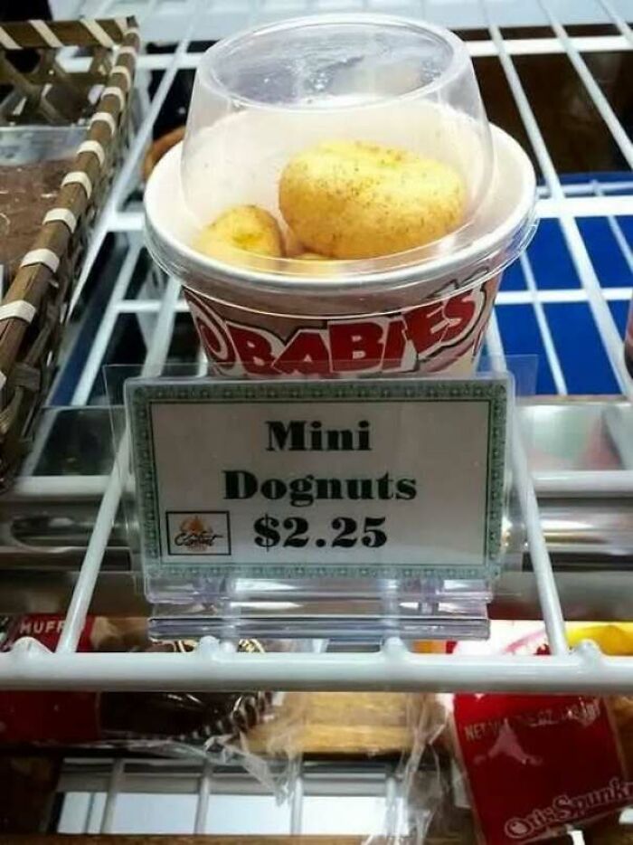 A funny typo sign reading Mini Dognuts instead of donuts