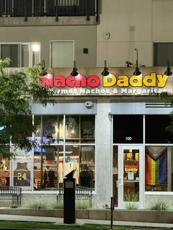 A funny store sign for Nacho Daddy, showing a hilarious sign design fail