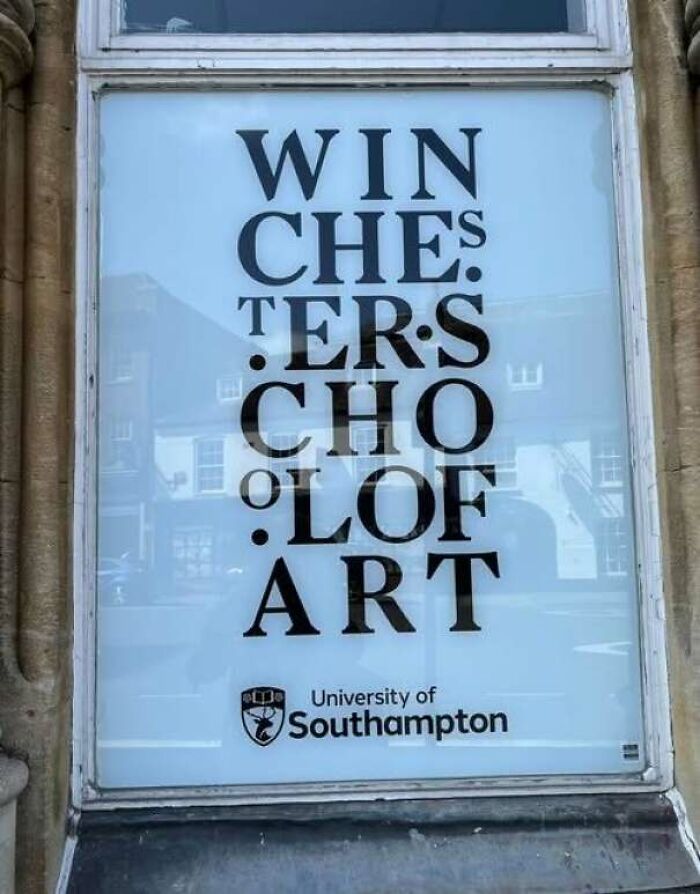 Window display showing awkward text formatting for Winchester School of Art, making it one of many hilarious signs.