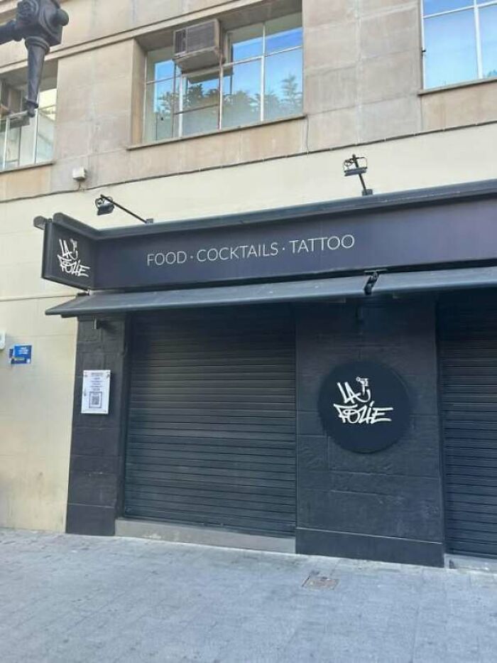 Hilarious storefront sign combining food, cocktails, and tattoo services under one roof