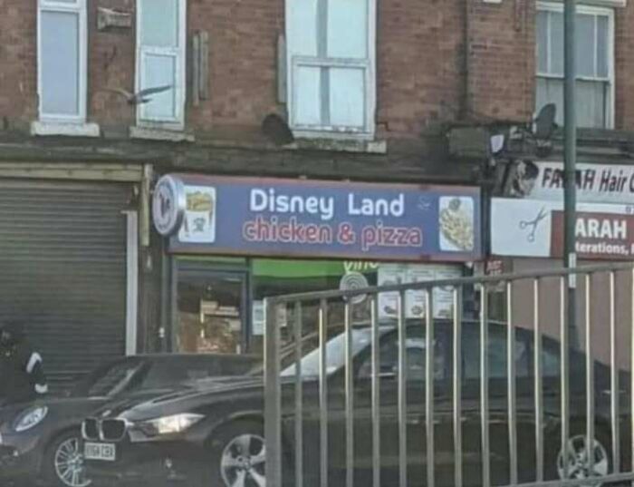 Hilarious shop sign for Disney Land chicken & pizza store.