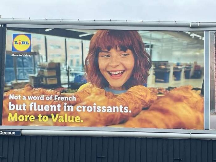 A supermarket billboard ad with unusual text phrasing serving as a hilarious ad.