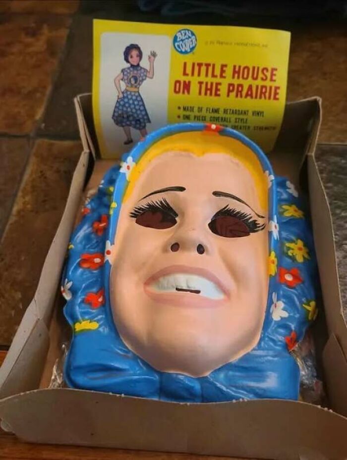 An eerie vintage costume mask for Little House on the Prairie showing a hilarious ad and product design fail.
