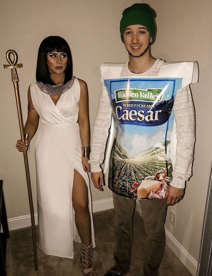 Cleopatra and Caesar dressing funny cool Halloween couples costumes with salad dressing pun outfit.