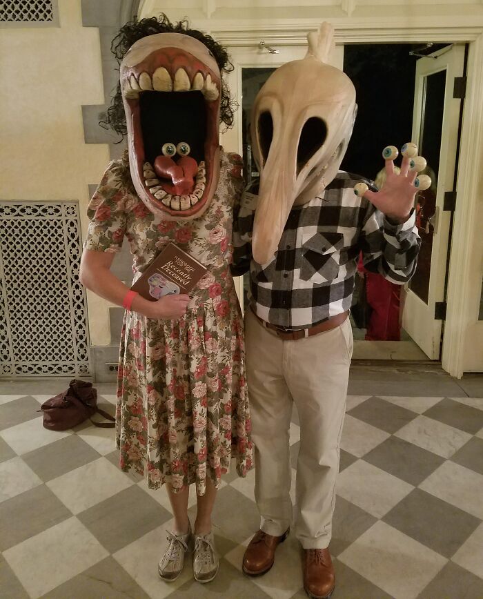 A couple in Beetlejuice monster masks showing funny cool Halloween couples costumes