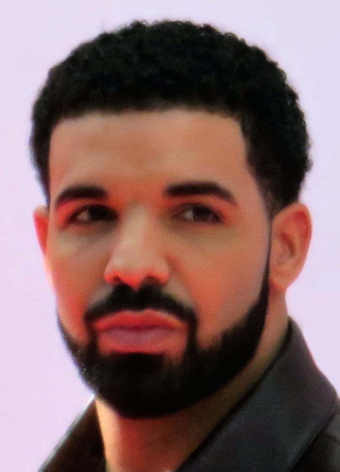 Close-up portrait of music artist Drake highlighting his bio and career.