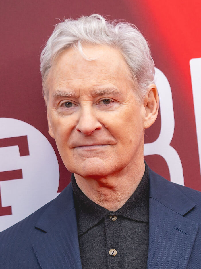 Actor Kevin Kline smiling at a red carpet event celebrating his career highlights