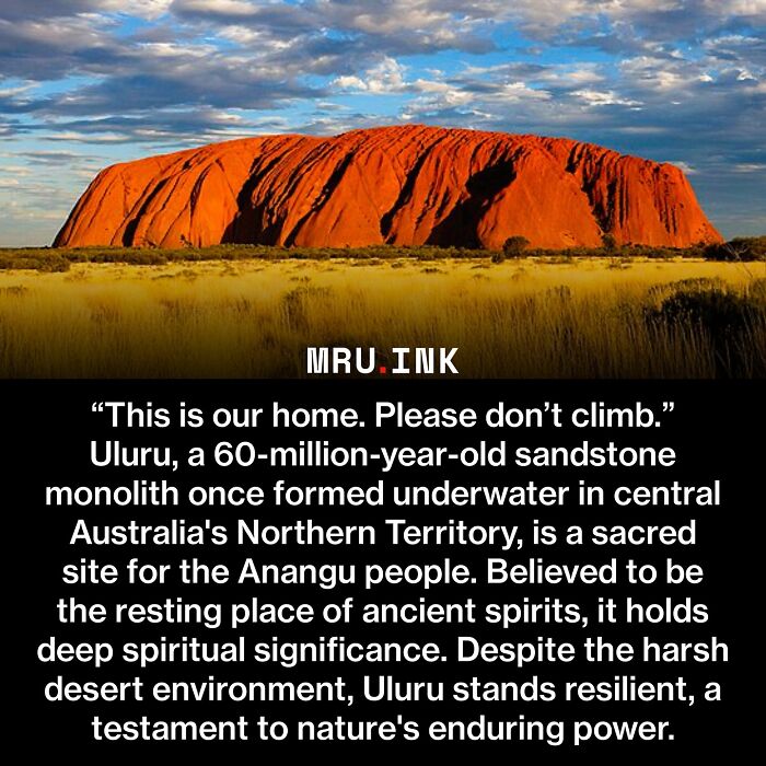 A red sandstone monolith, Uluru, showcasing strange world facts and natural wonders in Australia.