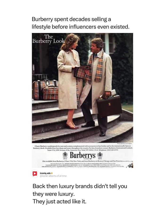 Classic Burberry print advertisement showing a stylish man and woman in trench coats for iconic ads.