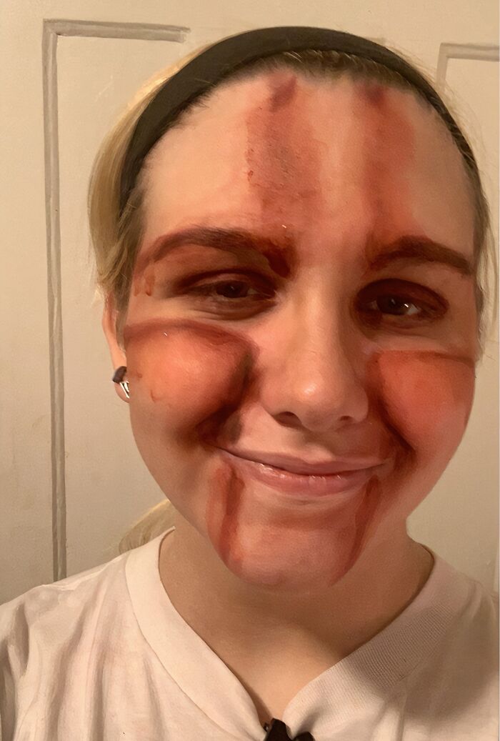 Smudged face paint failure on a woman, showing when Halloween didn't go as planned