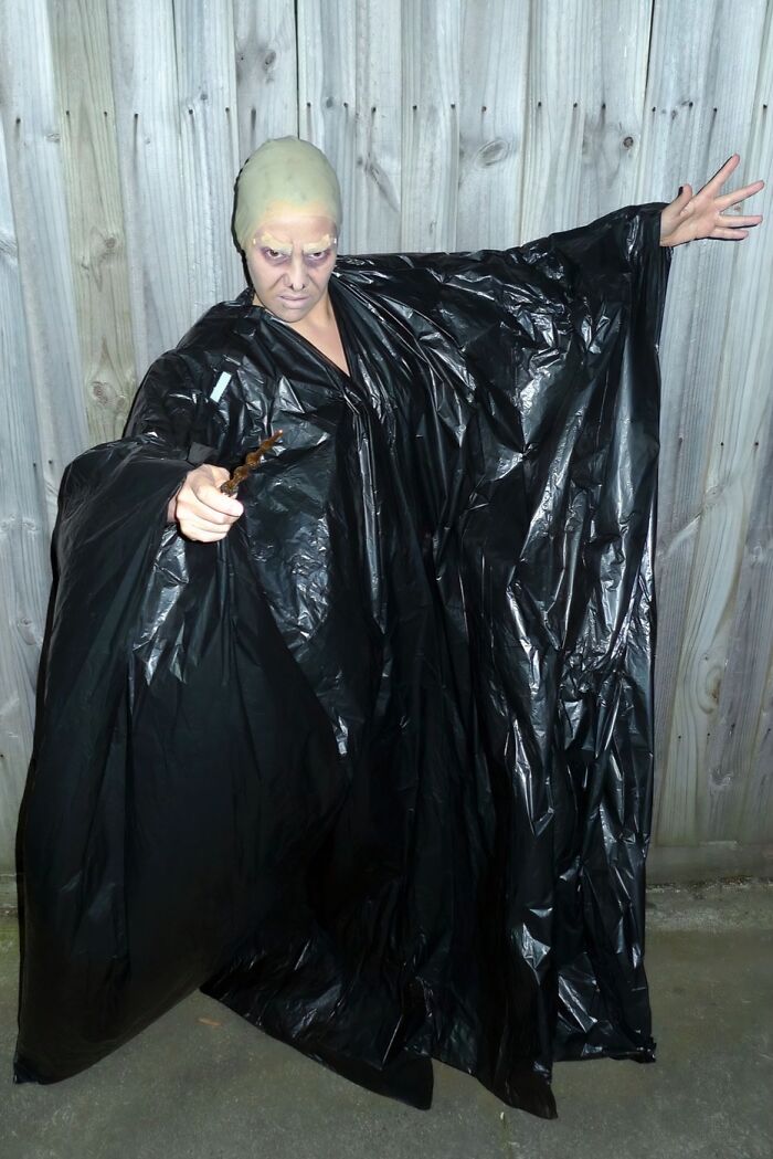 Funny Halloween costume fail featuring someone dressed as Voldemort in a black trash bag robe.