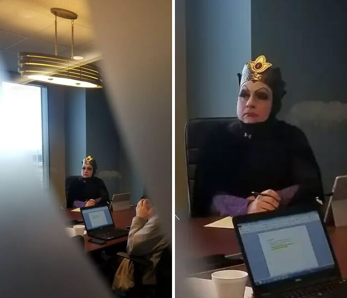 Funny Halloween costume photo of a woman dressed as an evil queen sitting in an office meeting
