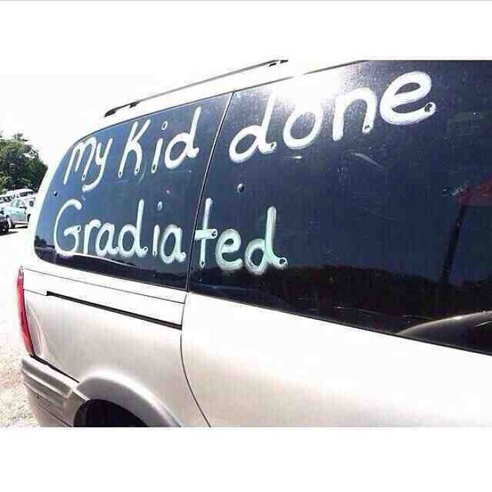 Car window writing with spelling fails reading My Kid done Gradiated.