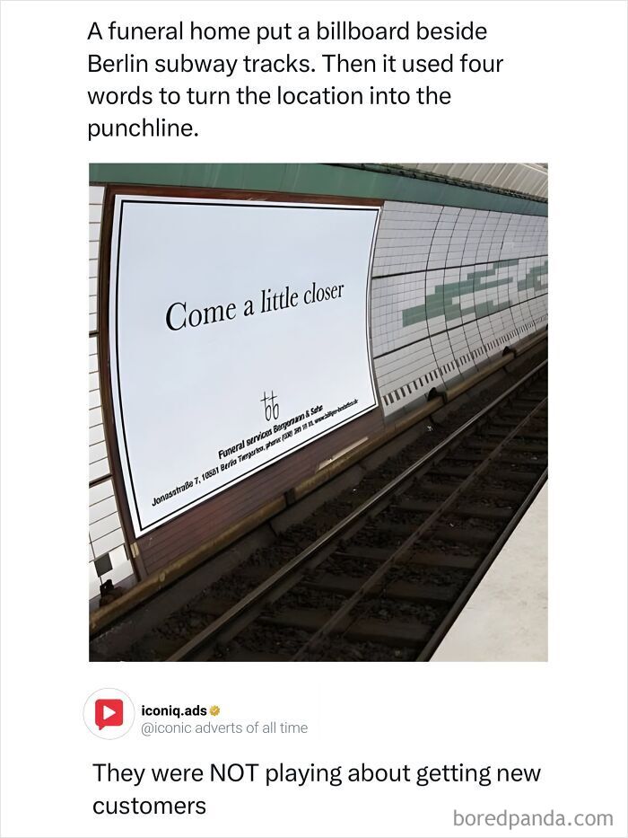 A white billboard on a subway track reading Come a little closer as an example of entertaining ads.