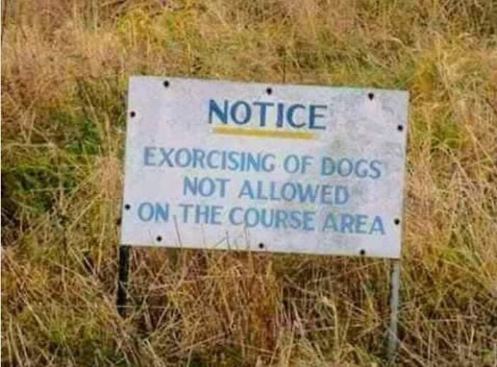 A sign with funny spelling fails stating exorcising of dogs is not allowed